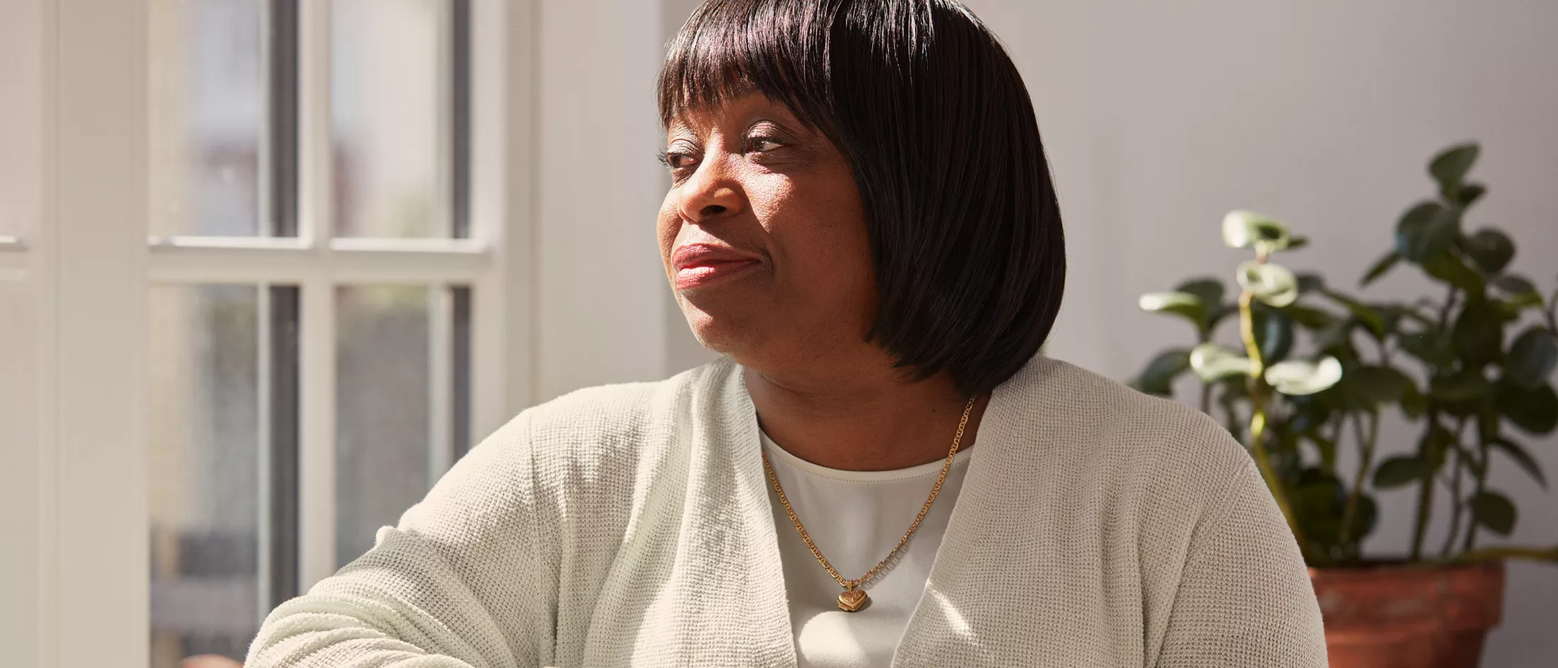 Rebecca looking to her right, thinking