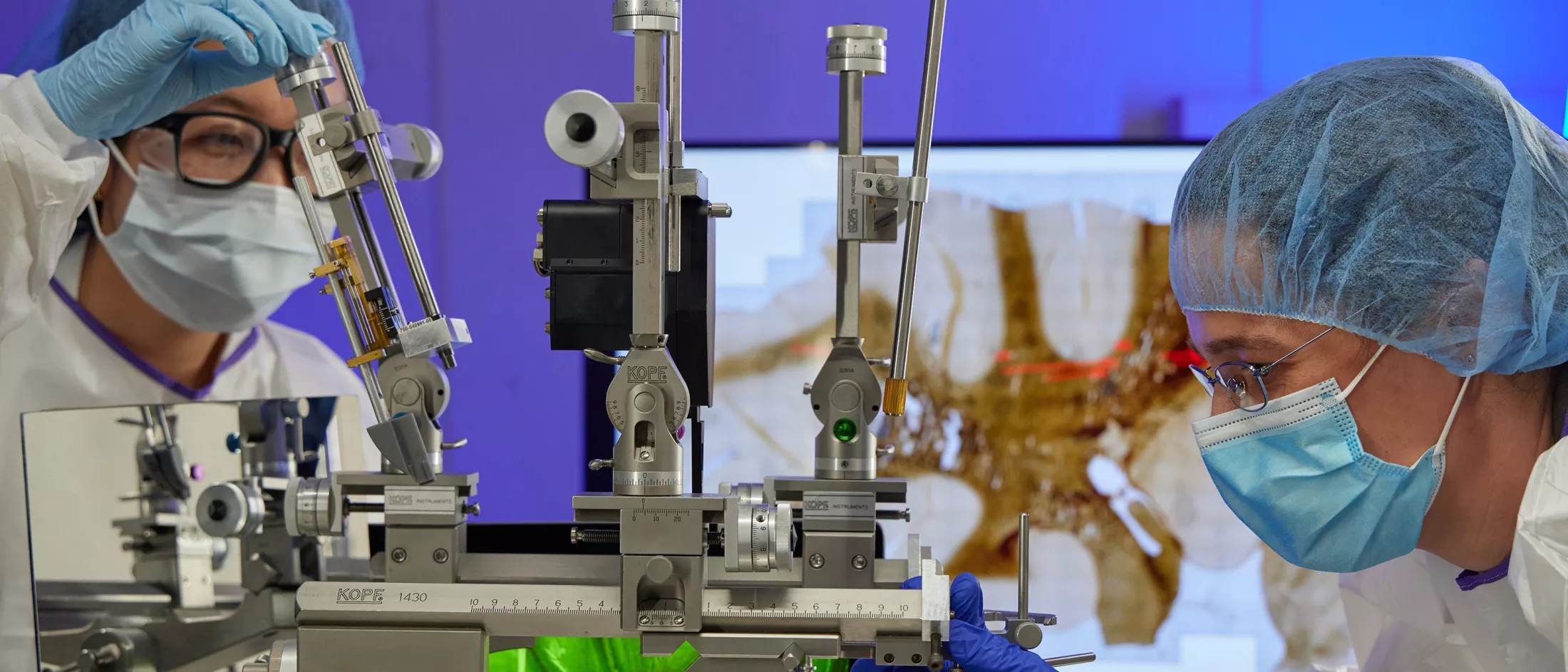 Two researchers doing experiments in the lab