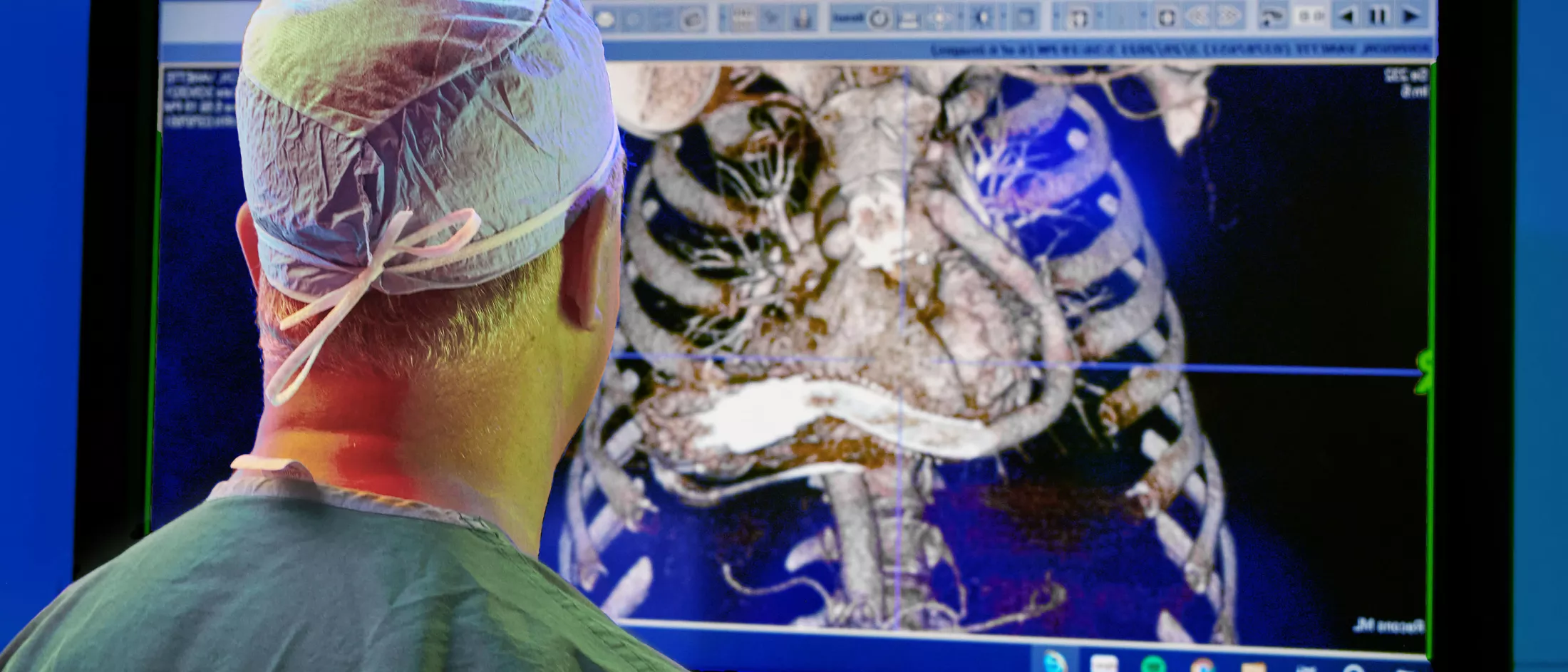 A physician looking at a screen