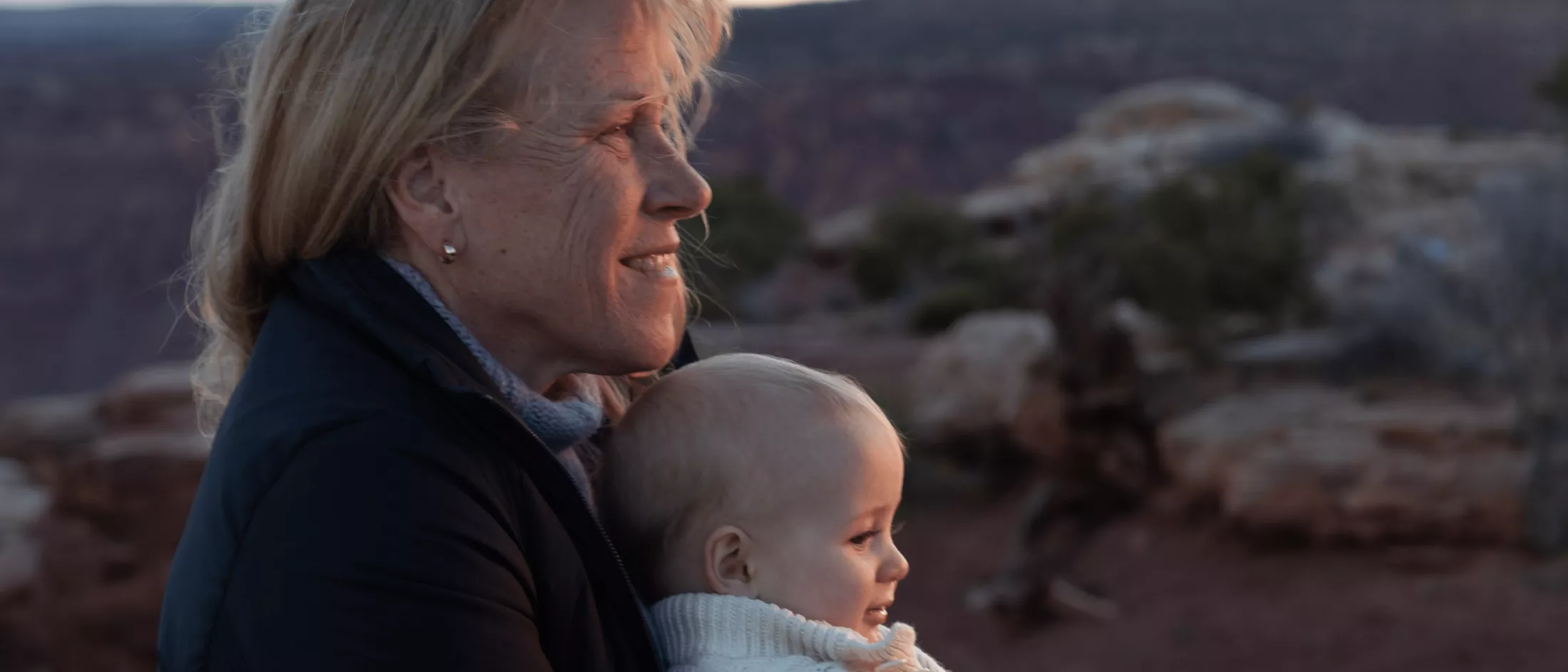 Barbara with baby Jack looking at the sun rise