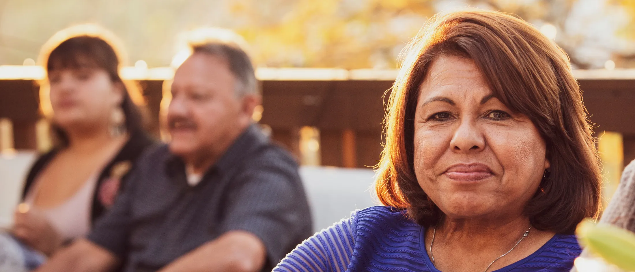 Older woman looking serene and confident at outdoor gathering