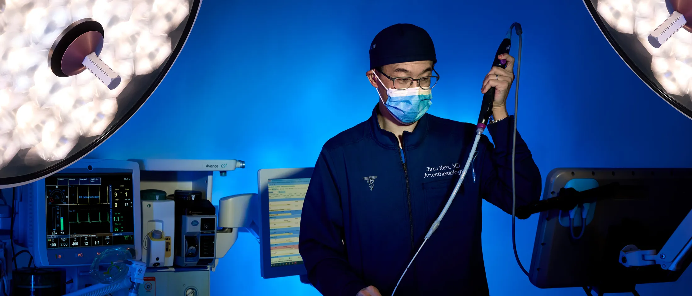 Doctor using medical scope during a procedure in operating room
