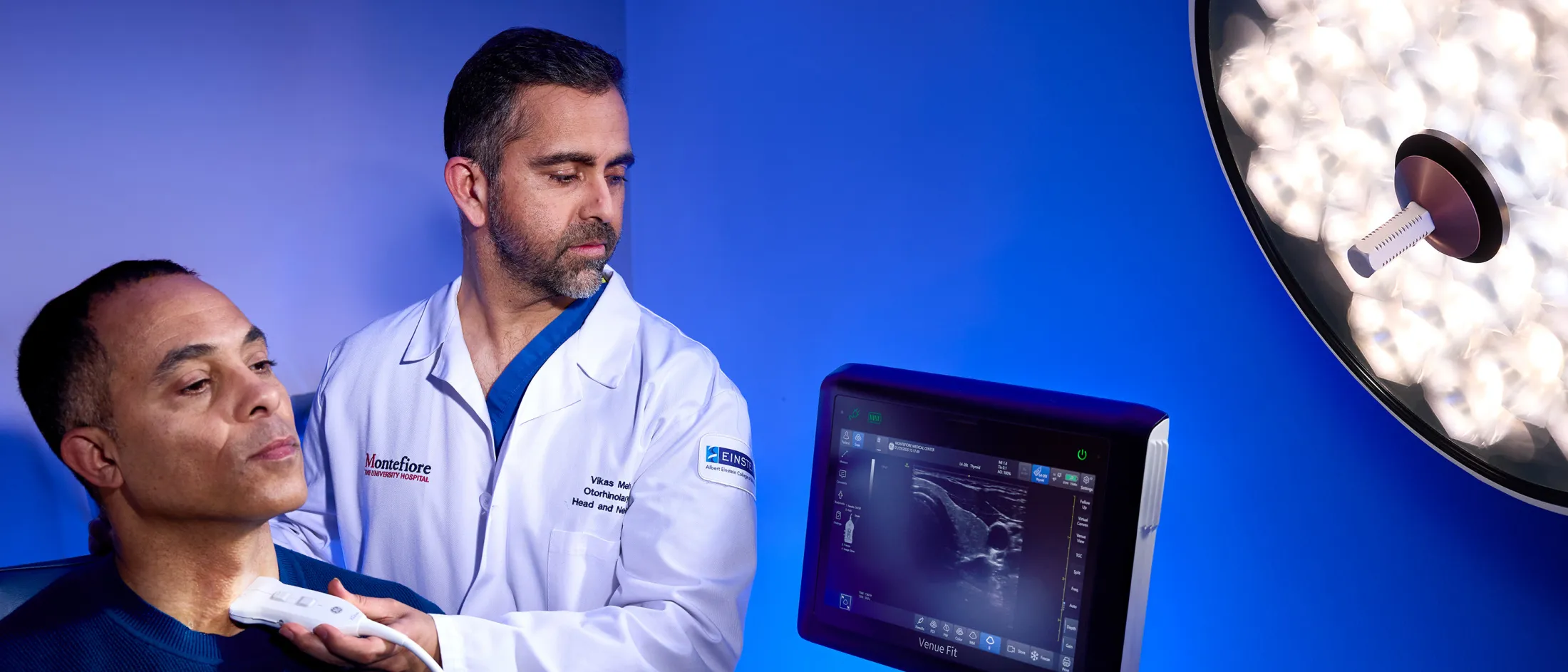 Doctor in white coat using ultrasound device on a patient's neck.