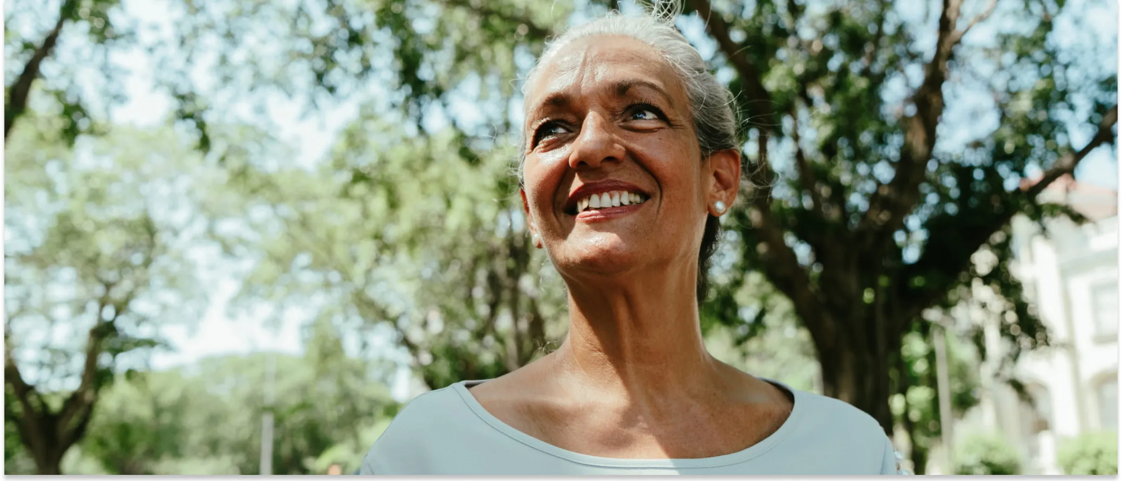 Woman wearing a white shirt and smiling