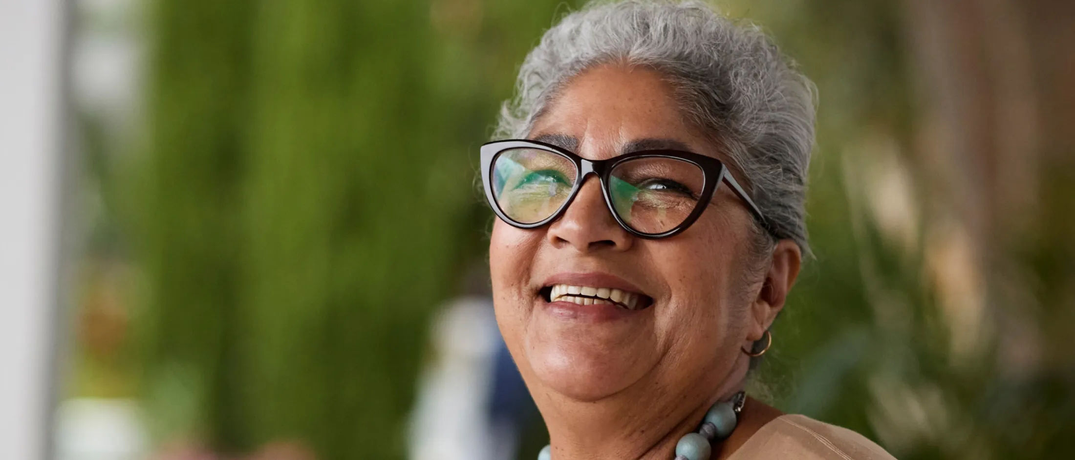 Woman smiling and wearing glasses