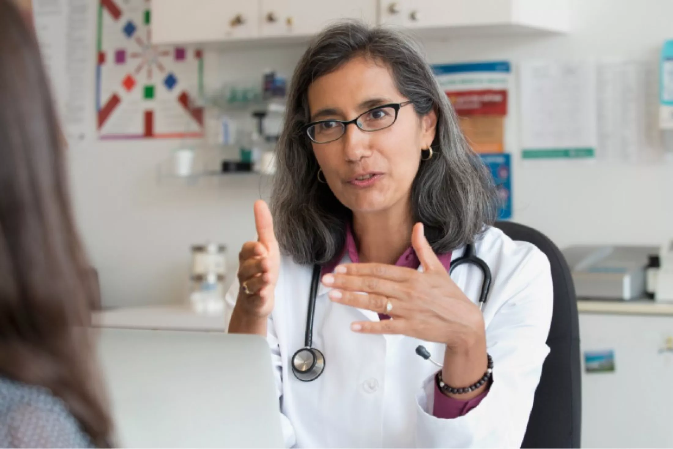 Primary care physician talking with patient.