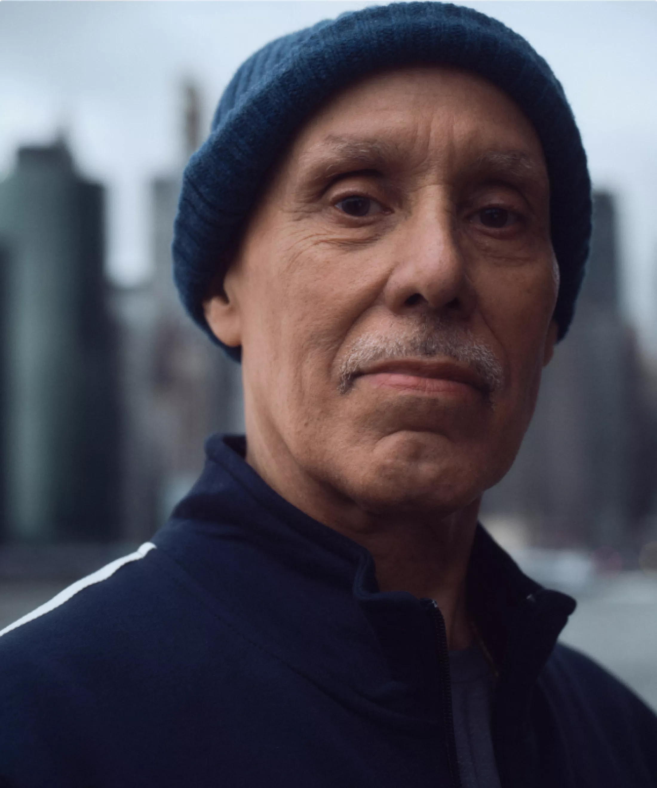 Paul in a jogging suit wearing a cap