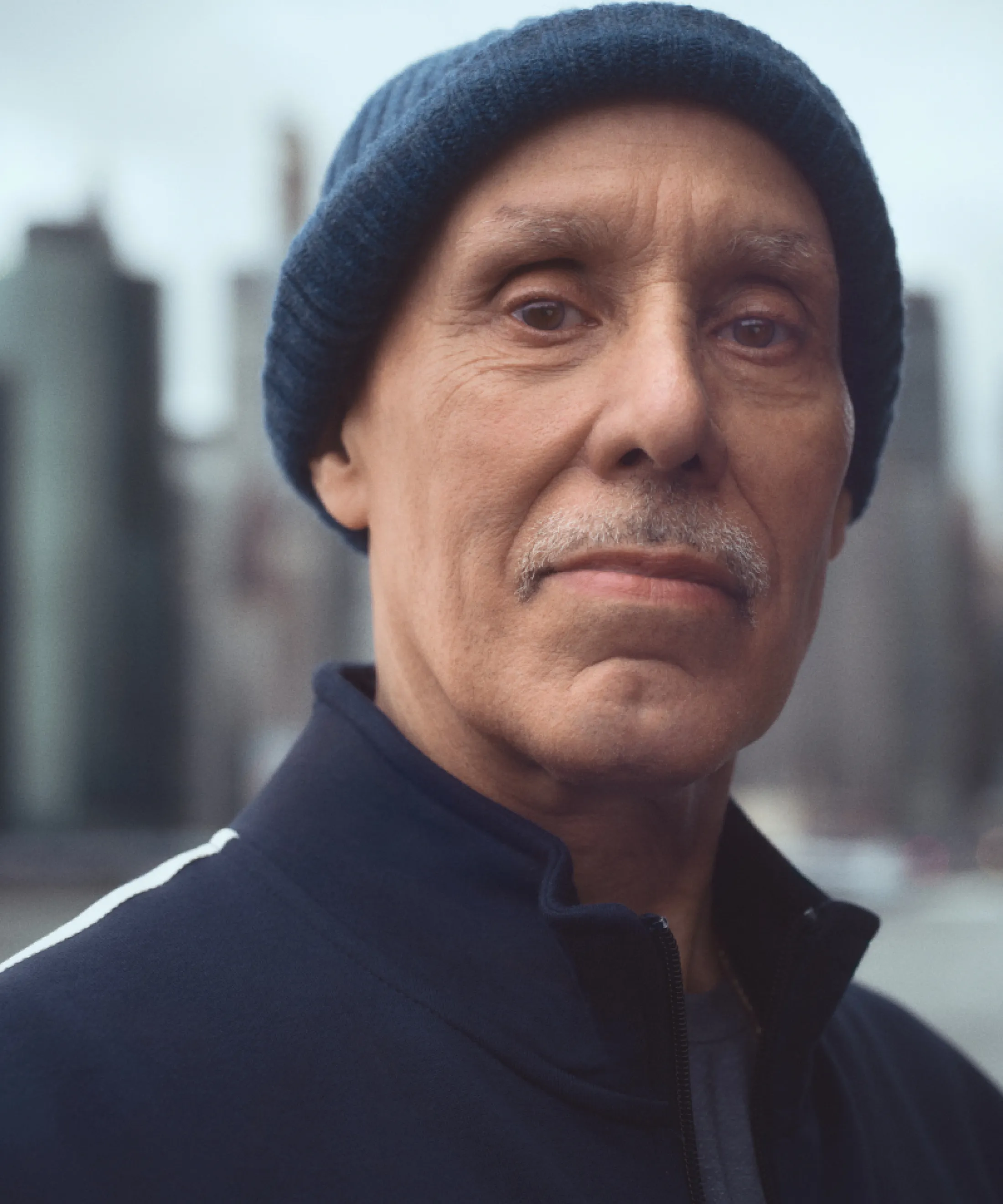 Paul in a jogging suit wearing a cap