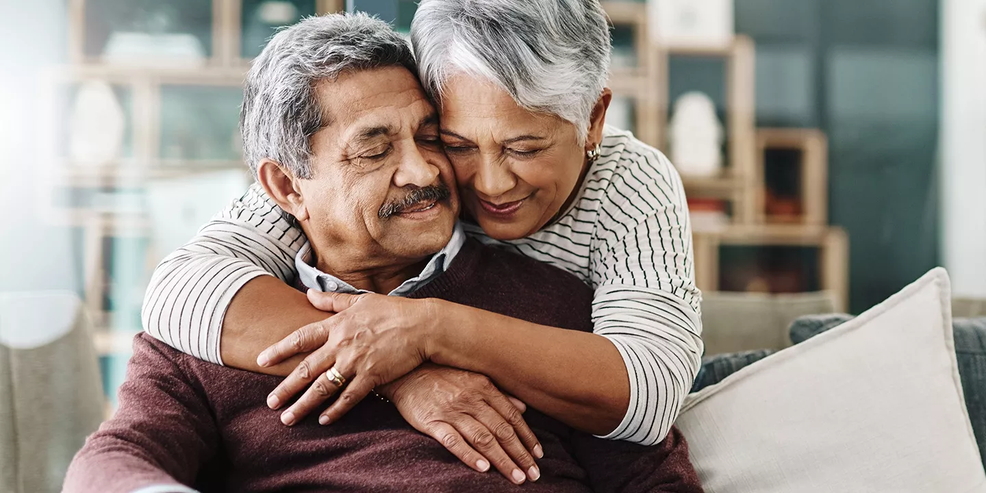 Woman hugging a man affectionately