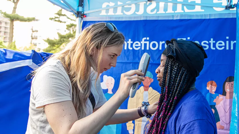 Professional offering a screening check to a patient in the community.