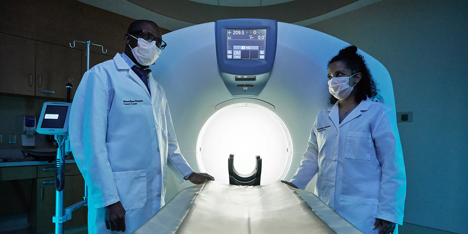 Specialist standing with state-of-the-art CT Scanner