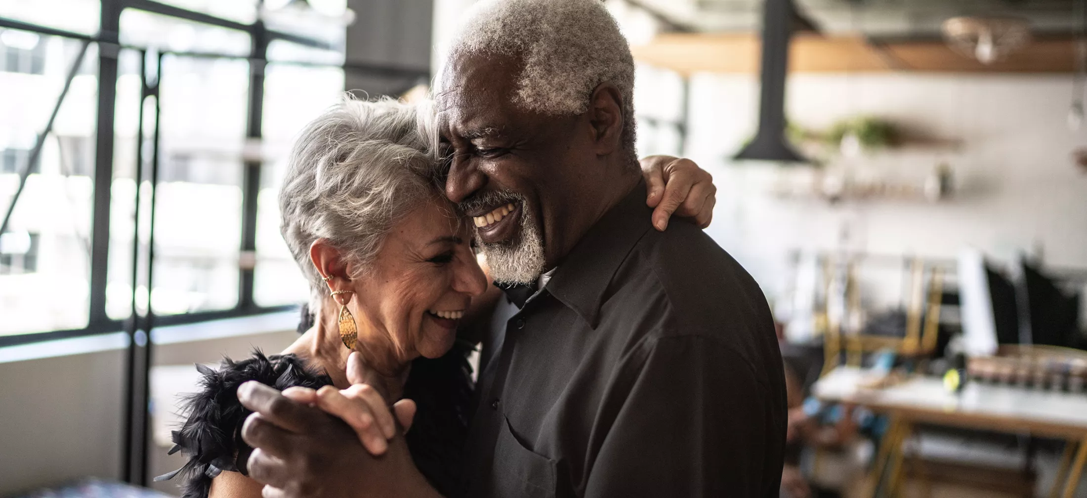 Senior couple waltz dancing in dance hall 