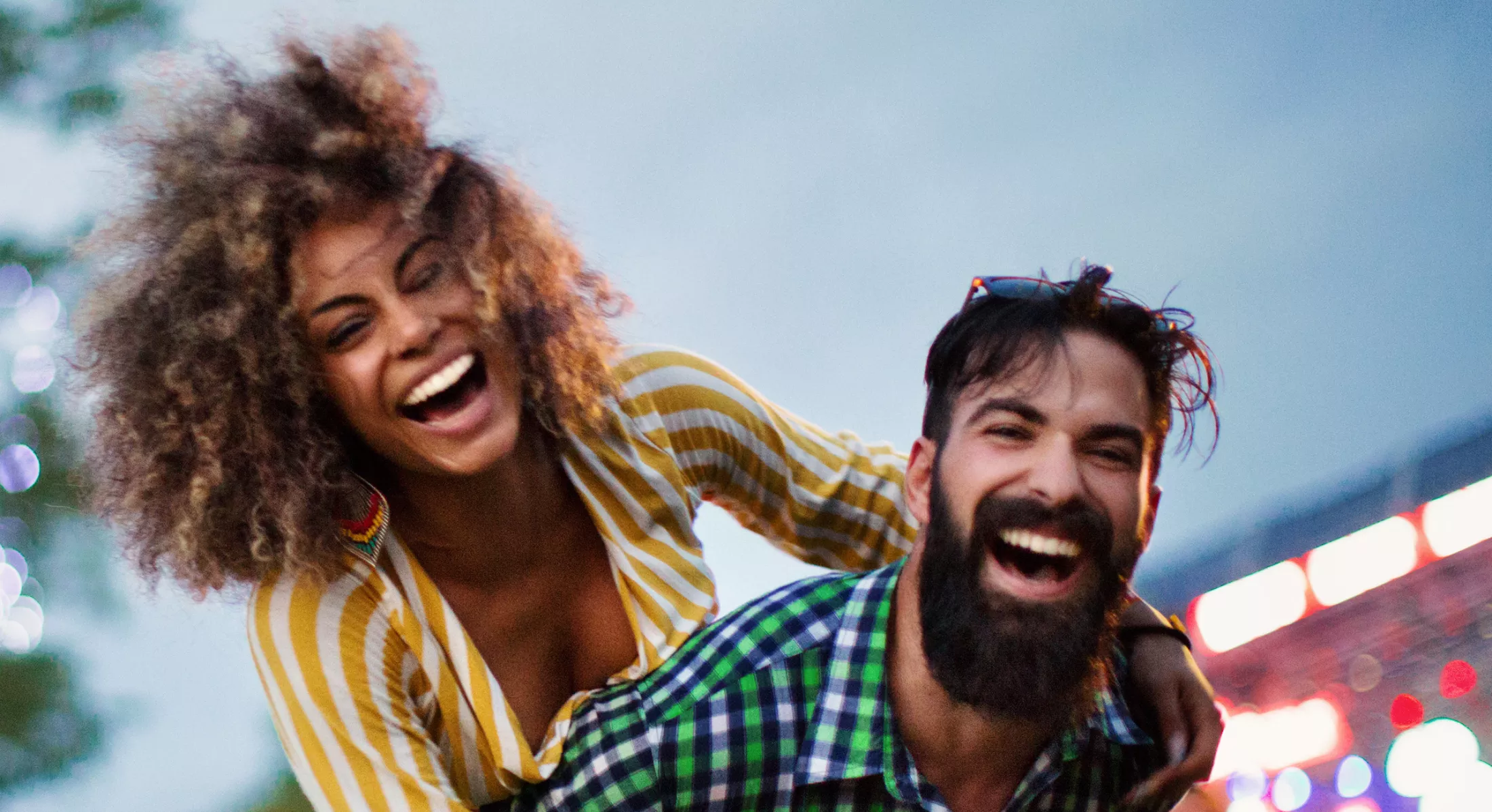 Young couple enjoying a music festival