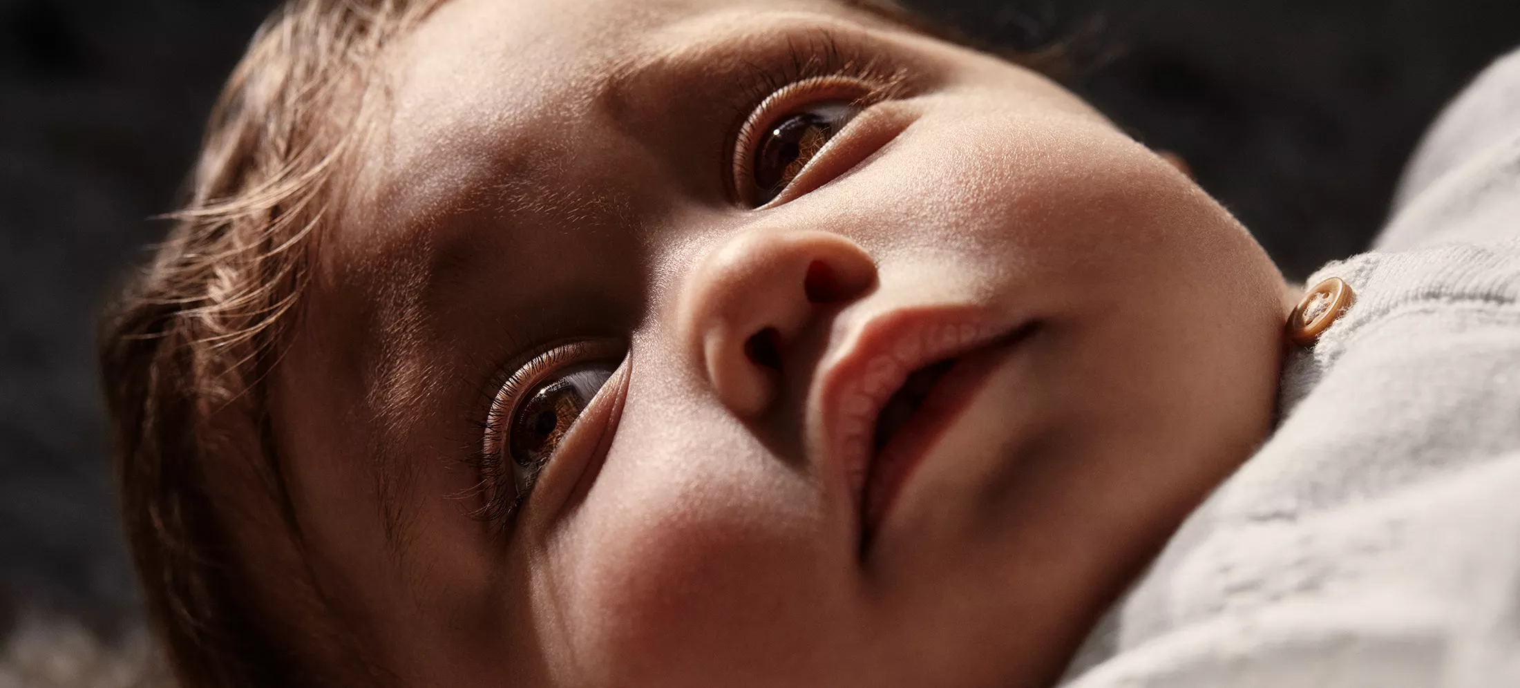 Baby Adriana laying down and looking up
