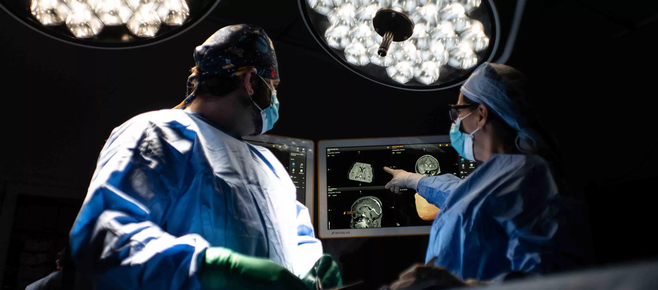 Two brain surgeons operating on a patient