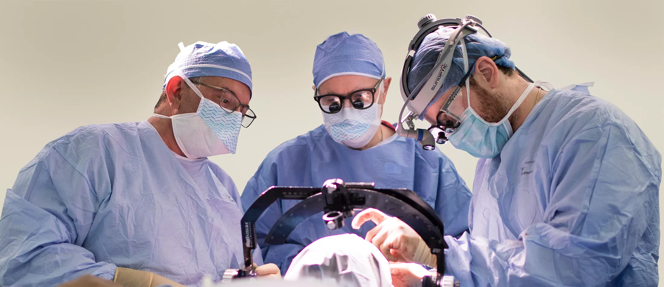 Nurosurgeons operating on a patient