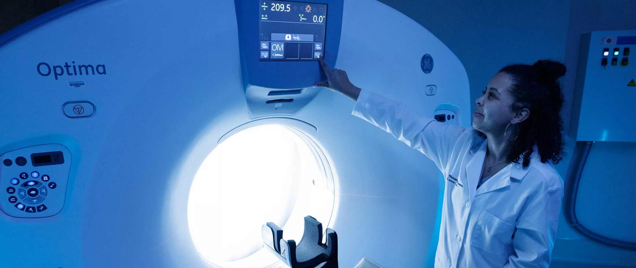 A medical professional standing next to medical equipment,