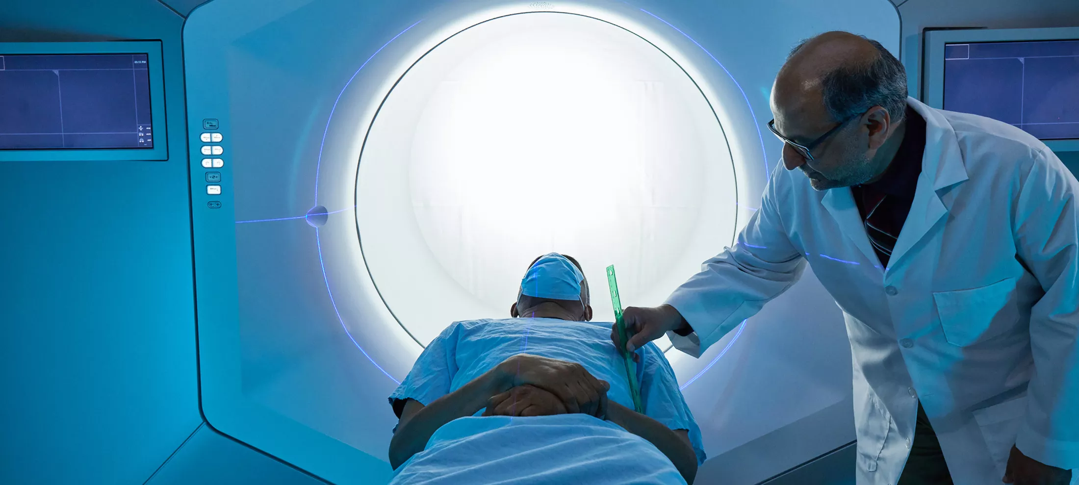 A physician tending to a patient in a CT Scanner