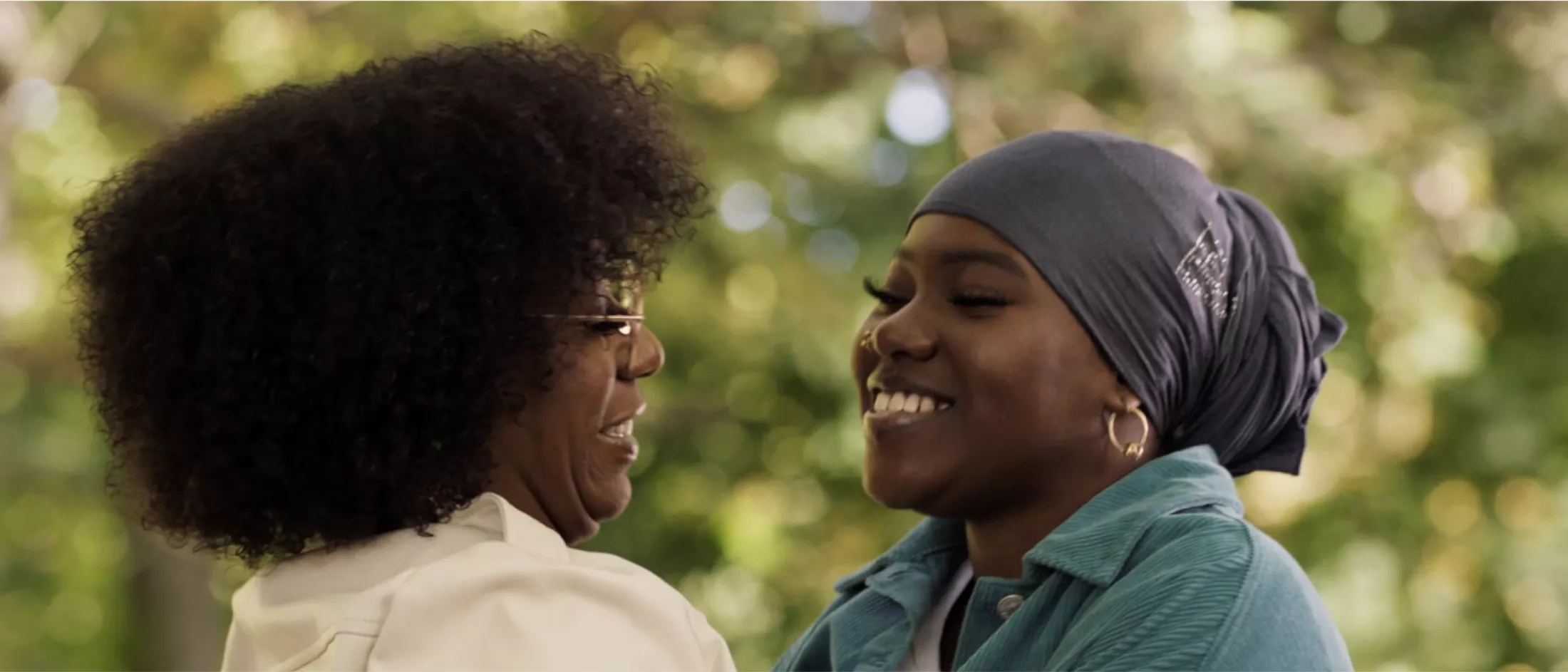 Two women embracing and smiling
