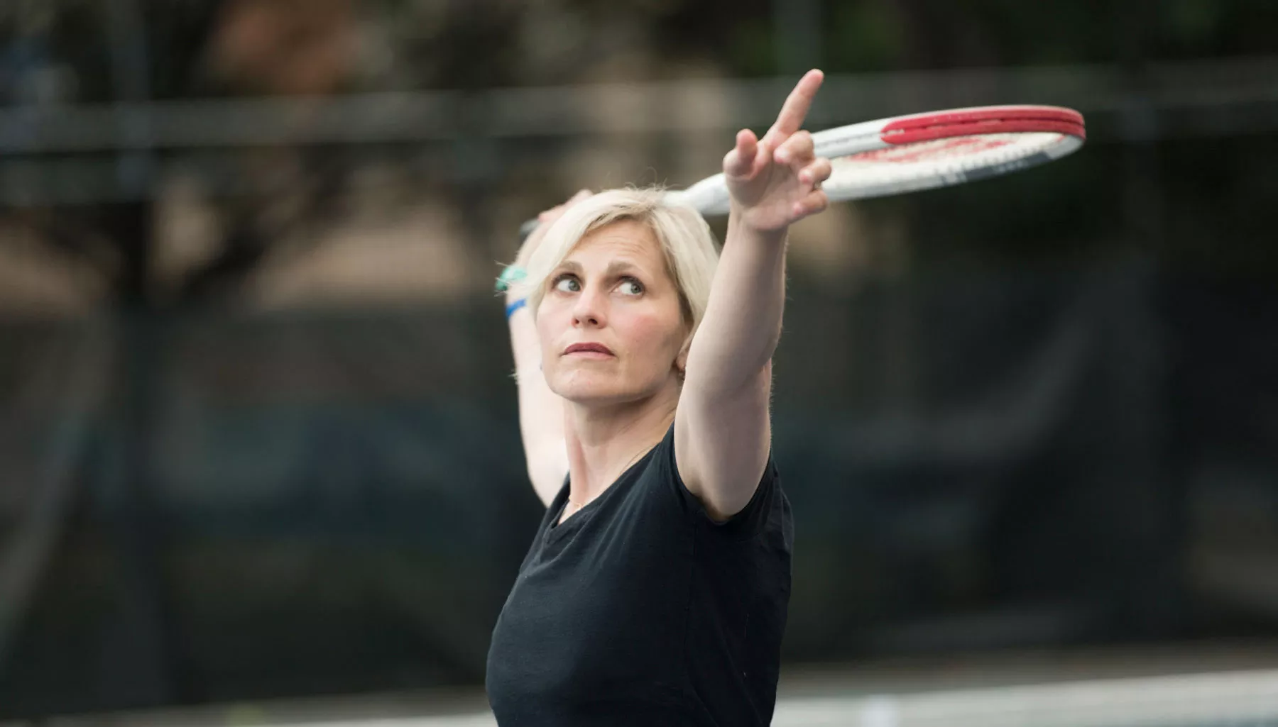 Mary Margaret playing tennis outside