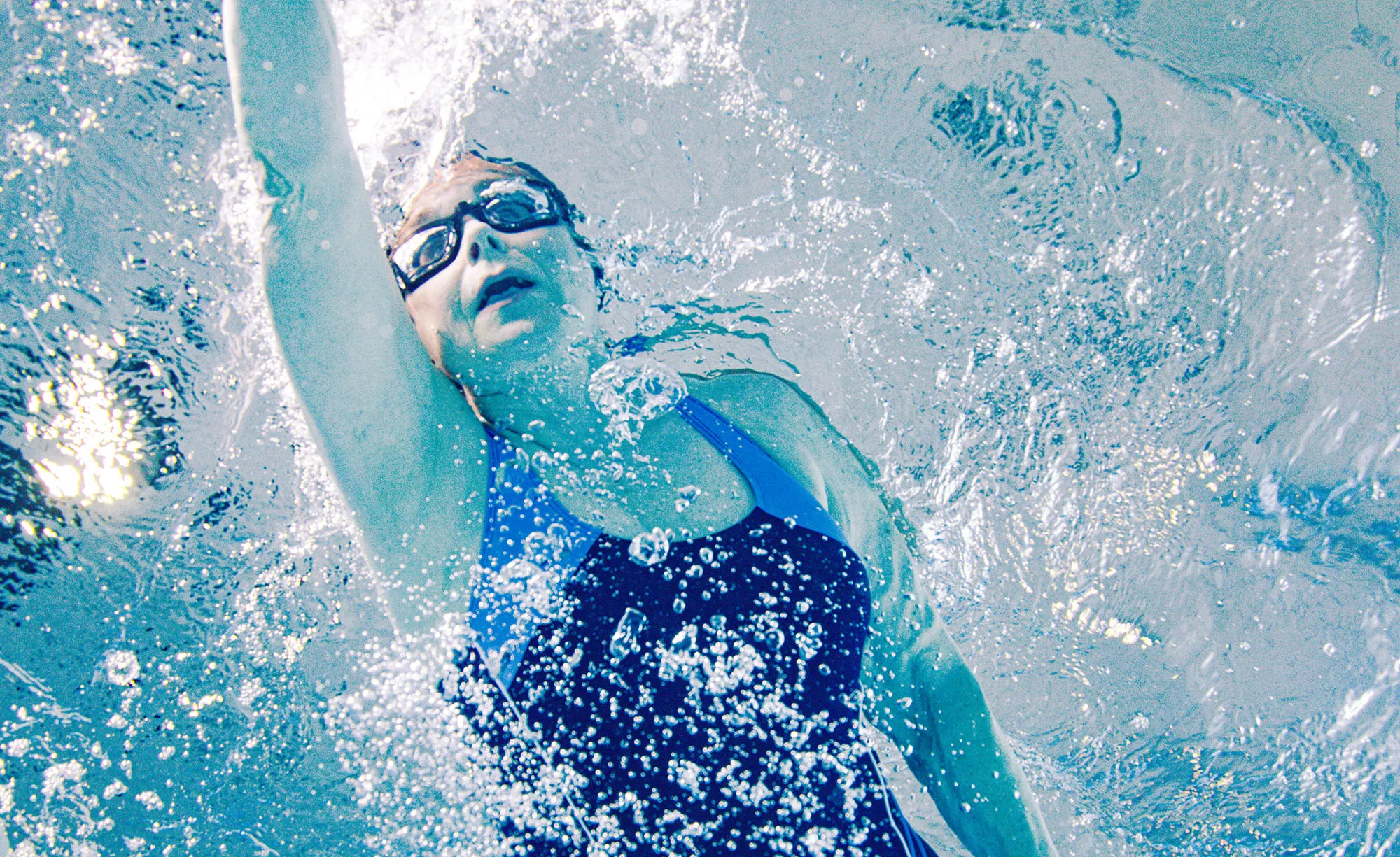 Phyllis swimming a lap in a pool