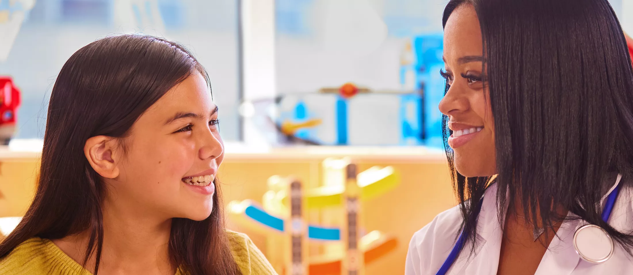 A physician talking with a young girl