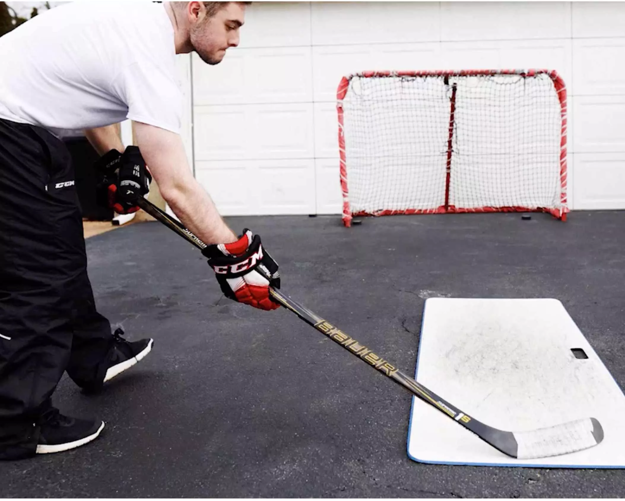 Jake playing hockey in the driveway