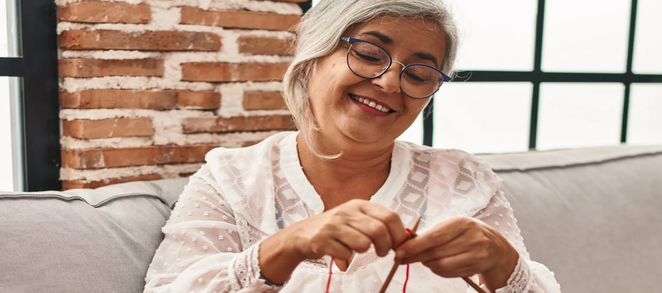 Woman with glasses, knitting