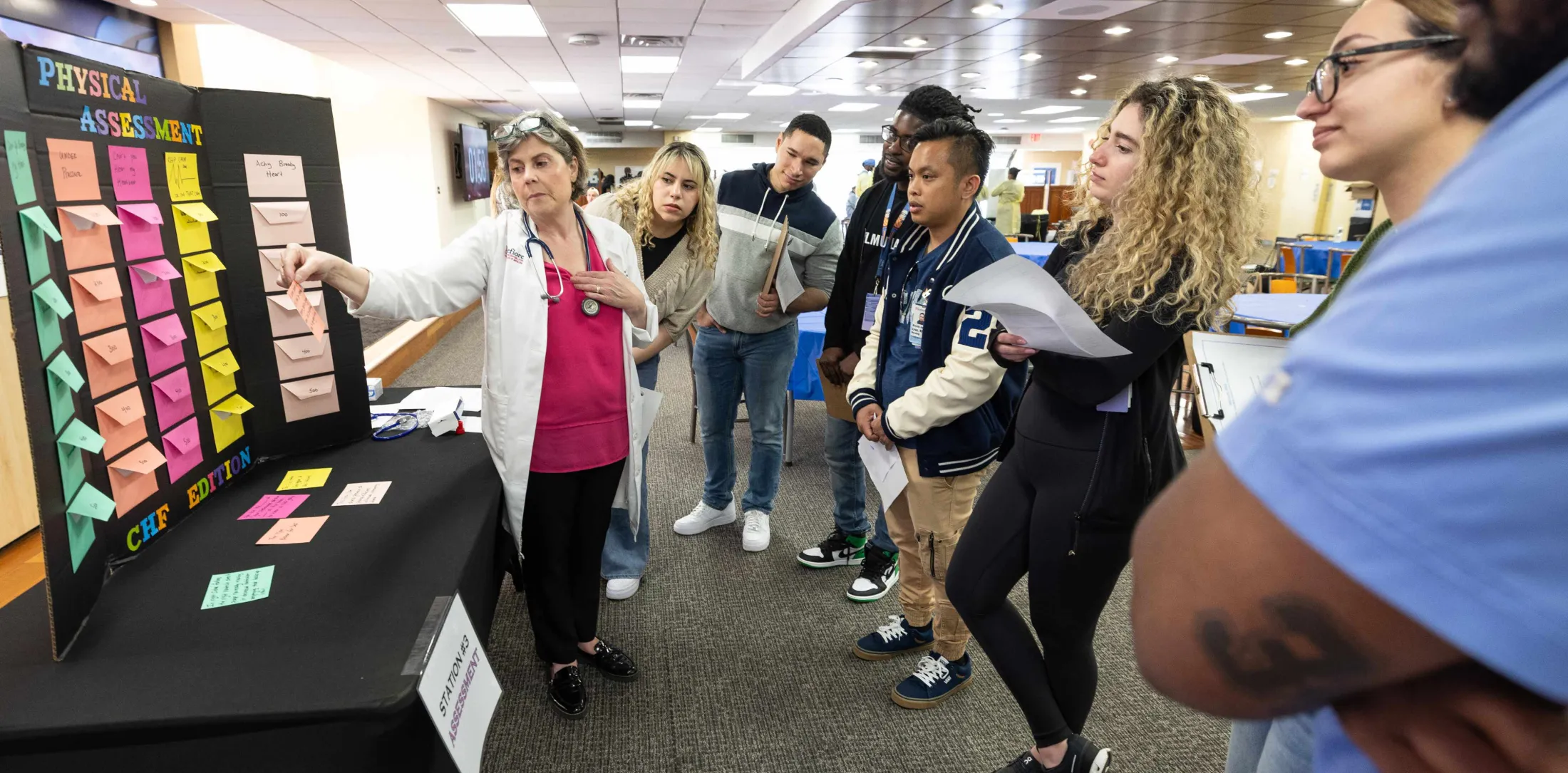 Doctor speaking with student nurses
