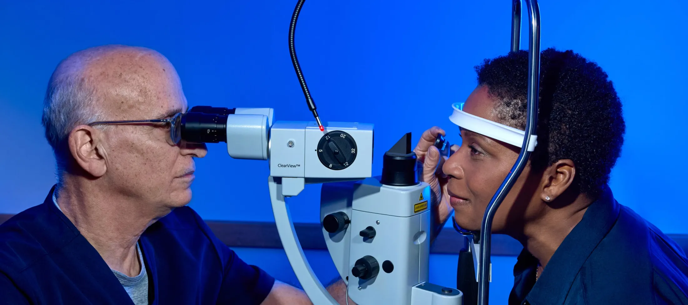 A patient receives an eye exam