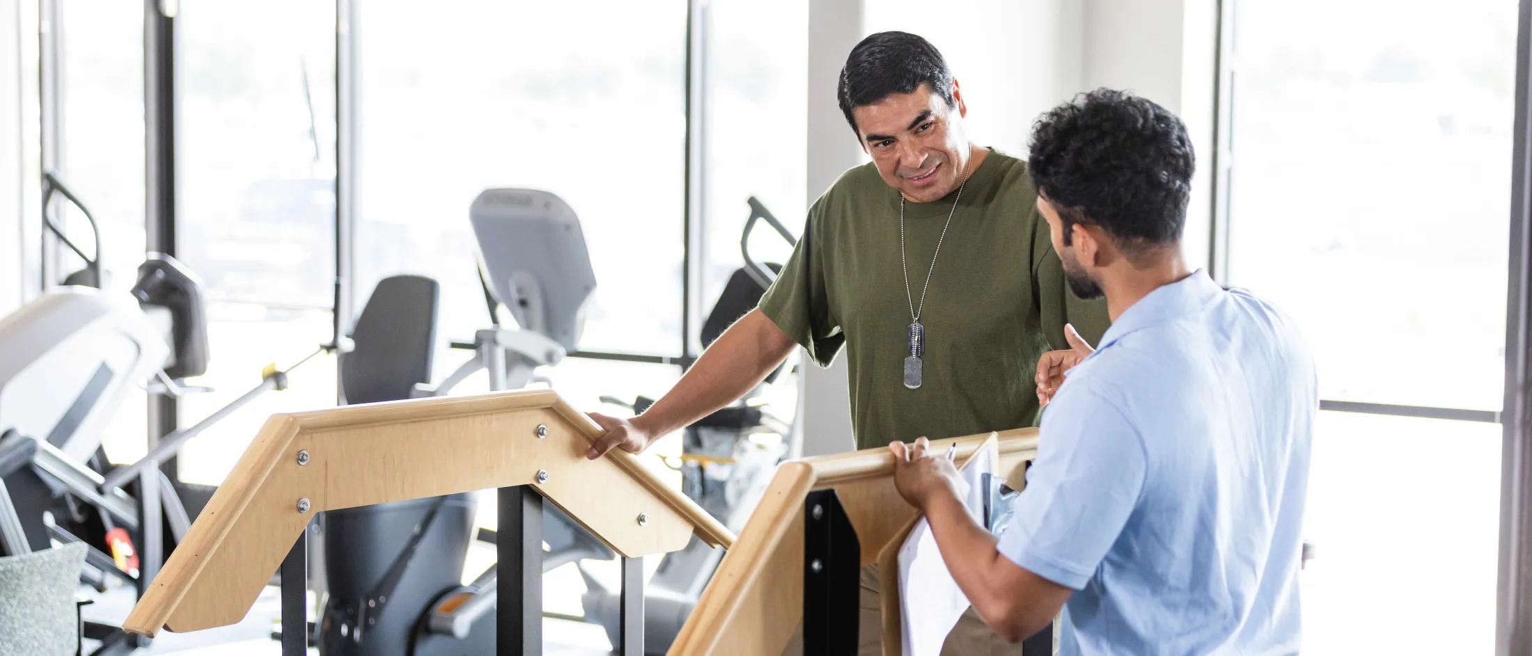 Rehabilitation technician working with patient.