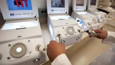 A physician using a minimally invasive surgery simulator 