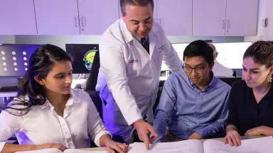 A physician and students in a classroom