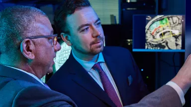 Two doctors looking at a screen