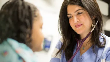 Nurse tending to patient