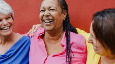 Three women laughing