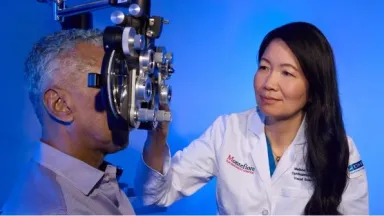 An ophthalmologist gives a patient an eye exam
