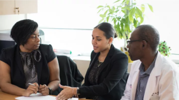 A team has a meeting around a conference table