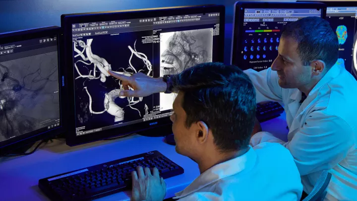 Duo of radiologists reviewing scans