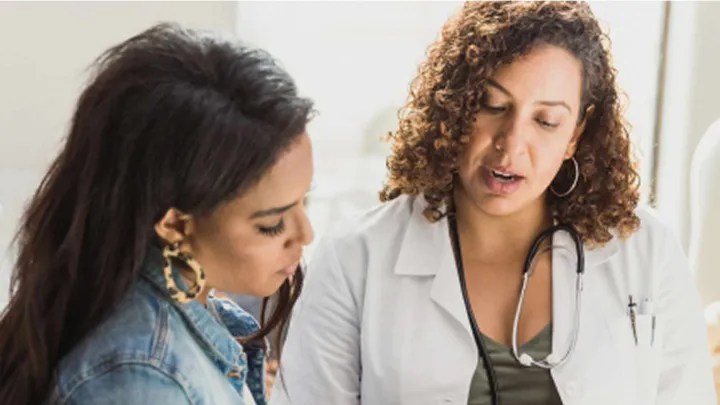 Doctor talking with patient