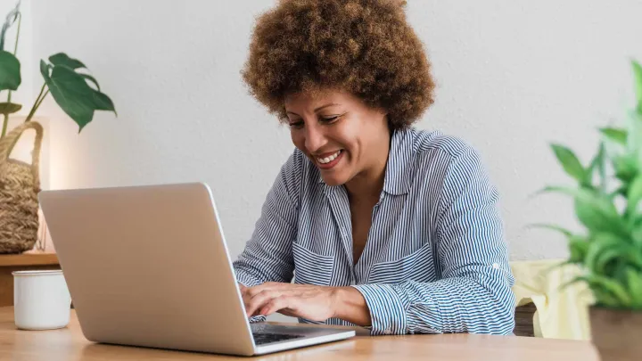 Woman typing on a laptop