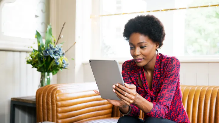 Schedule a Visit - woman on a tablet