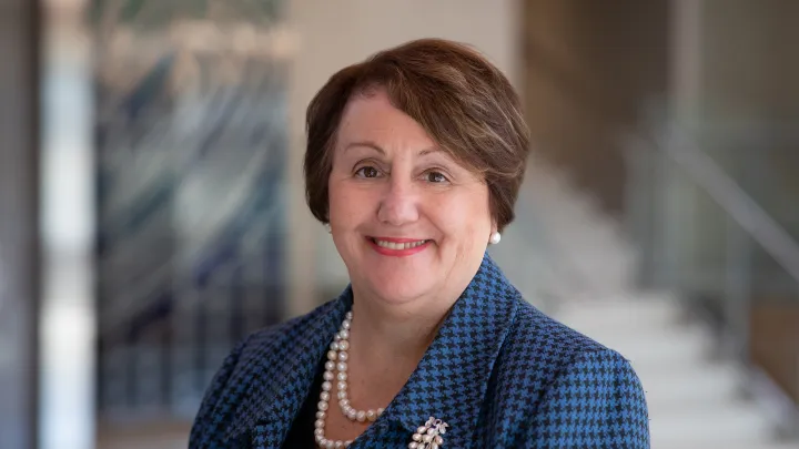 Professional portrait of Carol A. Sheridan, RN, smiling indoors