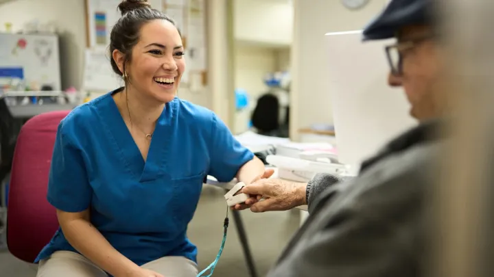Nurse taking oxigenation of an old gentleman