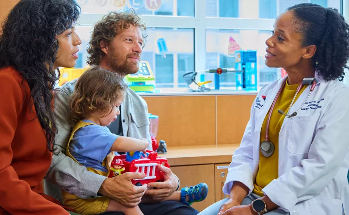 A family talking with a physician about transplantation