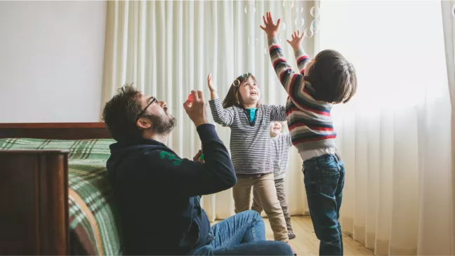 man-playing-with-kids