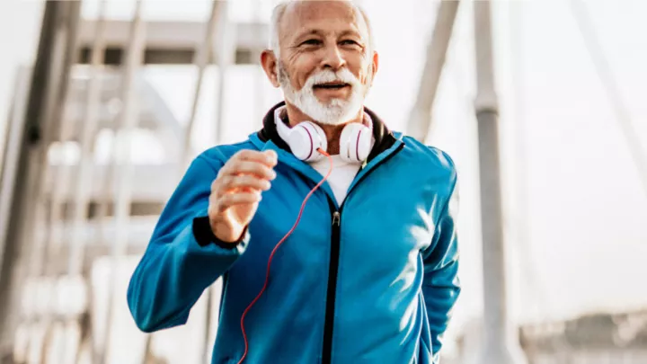 Senior Man jogging on Bridge