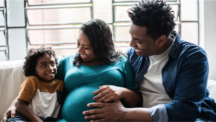 Family of three on a couch