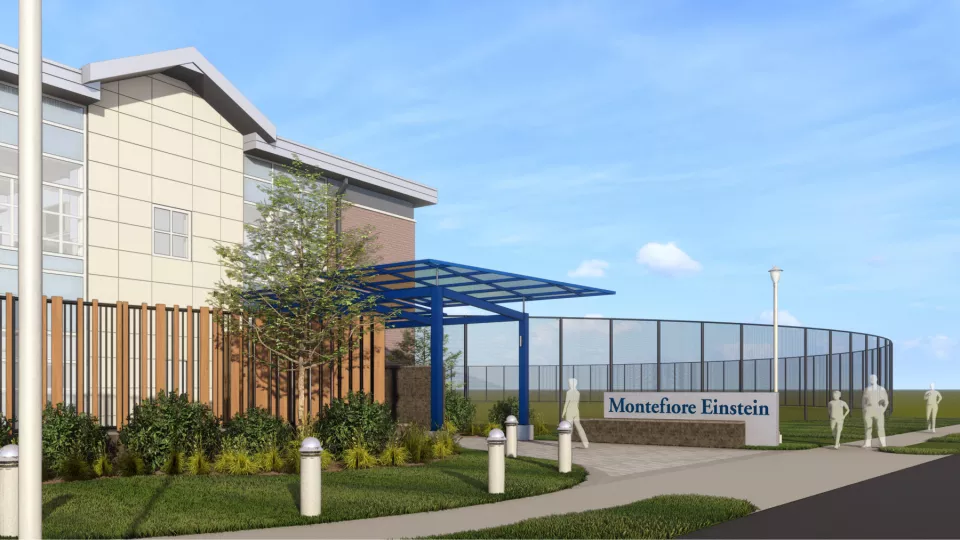 A 3D digital rendering of a hospital, viewed from the front entrance.