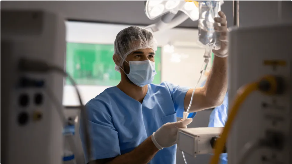 Anesthesilogist technitian preparing IV